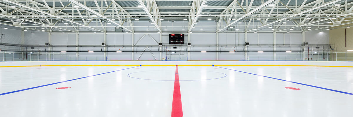 View of indoor ice rink from center red line.